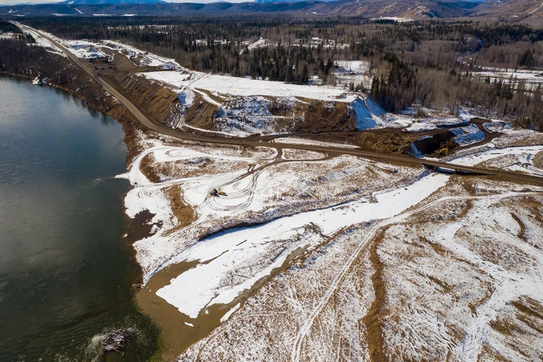 Aerial photo of the Highway 29 realignment at Lynx Creek showing work underway on the west abutment. | March 2021
