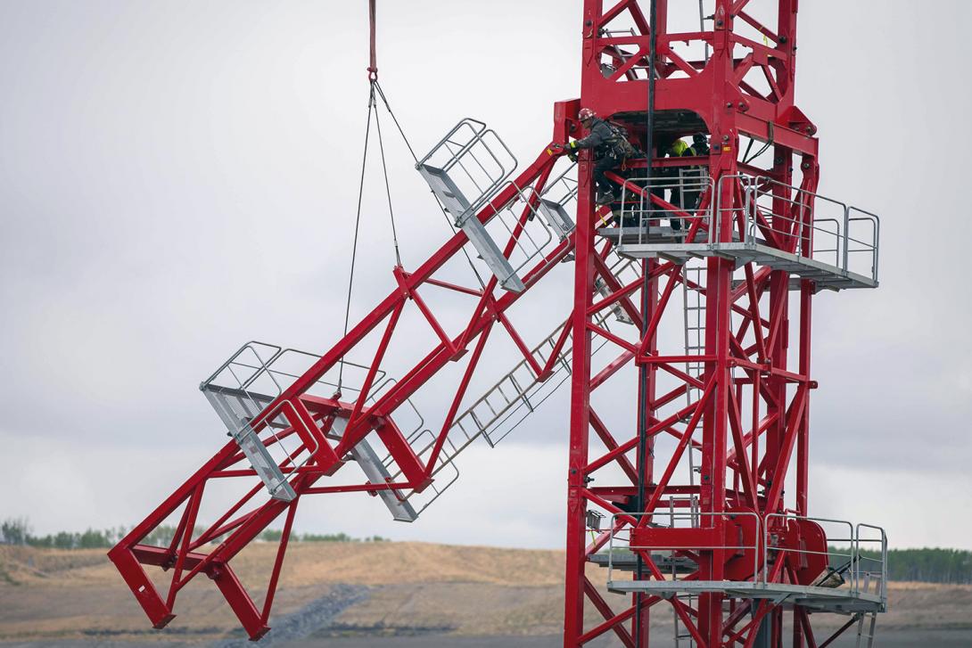 Dismantling the access assembly platforms on a newly erected tower crane at the spillway basin. | May 2021 