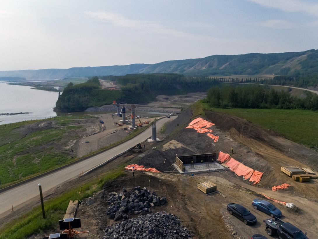 Highway 29 alignment at Farrell Creek in varying stages of construction, showing the abutments at either end with five bridge piers. | July 2021