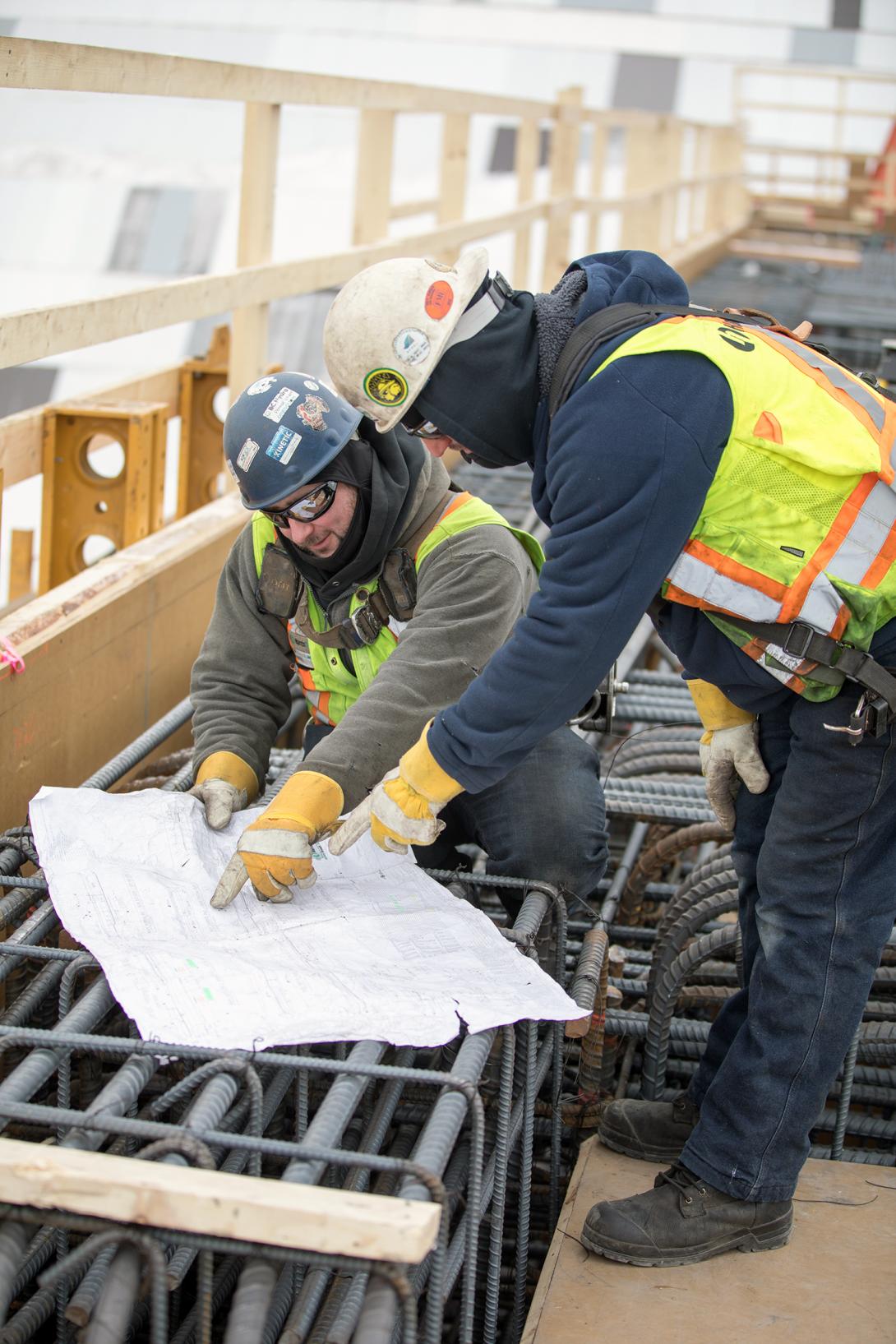 Harris Rebar workers reviewing drawings for the main service bay area. | February 2019