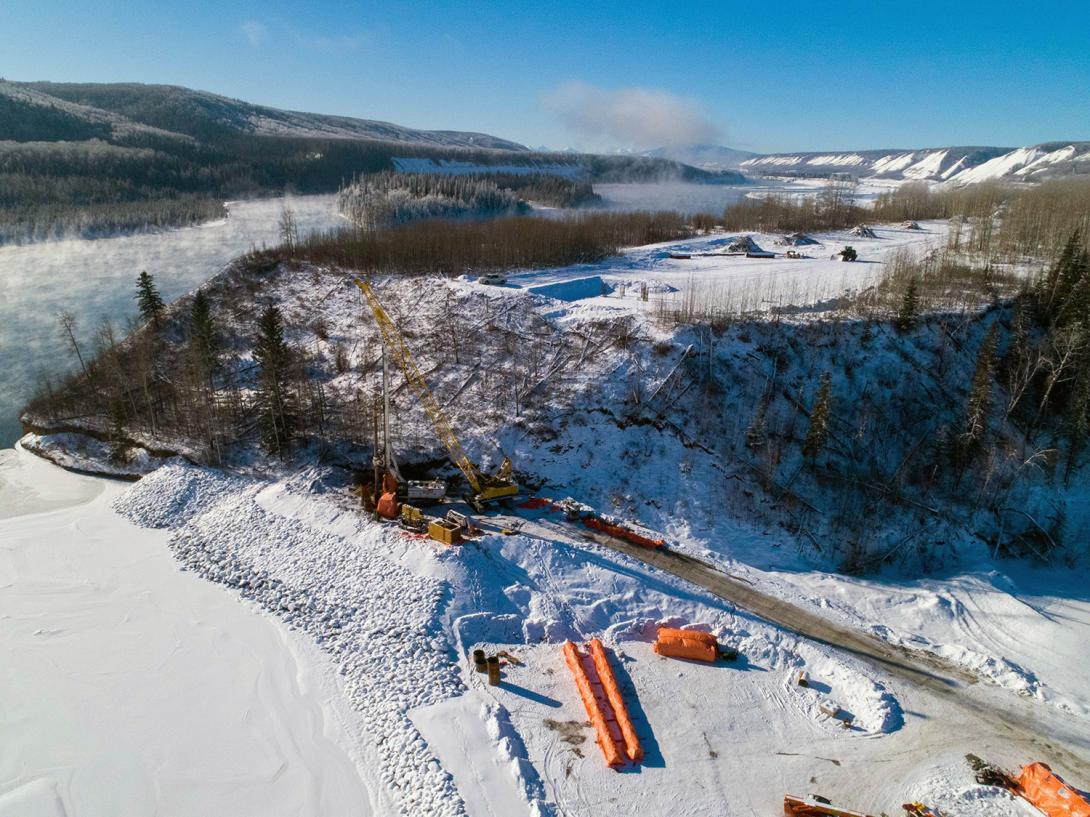 Crews drill piles for pier 1 of the Farrell Creek bridge. Construction is underway on the new highway segment and bridge at Farrell Creek. | February 2021