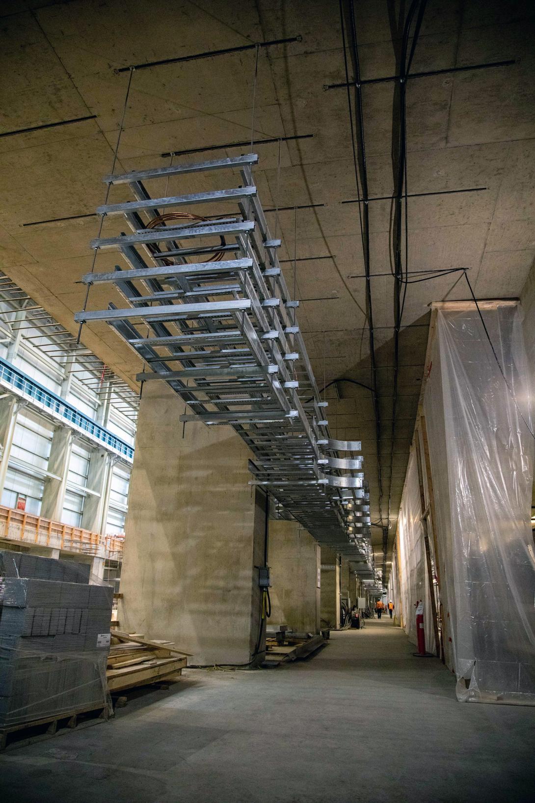 Installation of cable trays is underway in the powerhouse. | June 2022