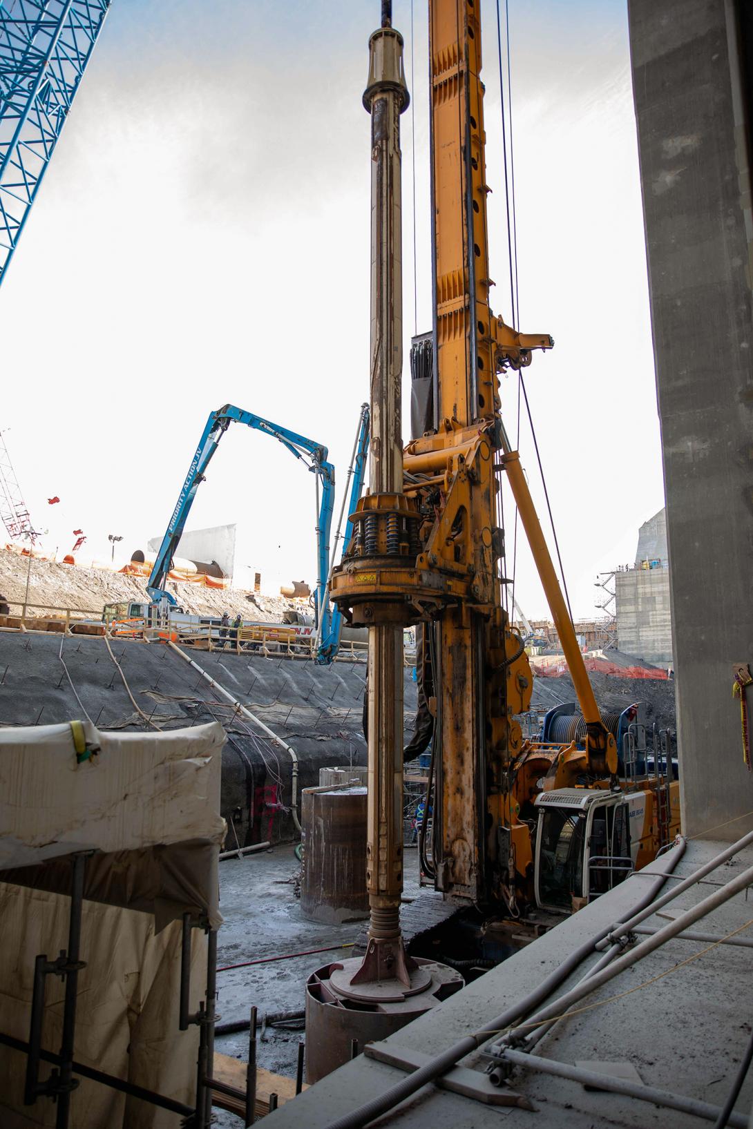 A pile driver is used to core holes 60 inches in diameter and 40 metres deep, as part of foundation enhancement at the tailrace. ! September 2022