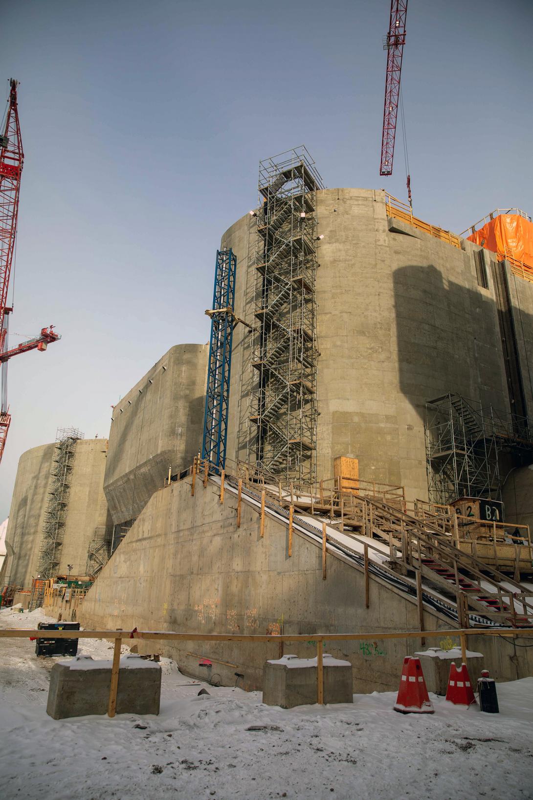 Workers regularly climb the 17-storey staircase at the centre block of the spillway headworks. | March 2023
