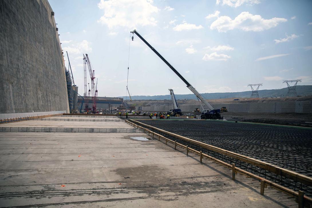 Crews prepare the concrete erosion slabs in the approach channel. | June 2023
