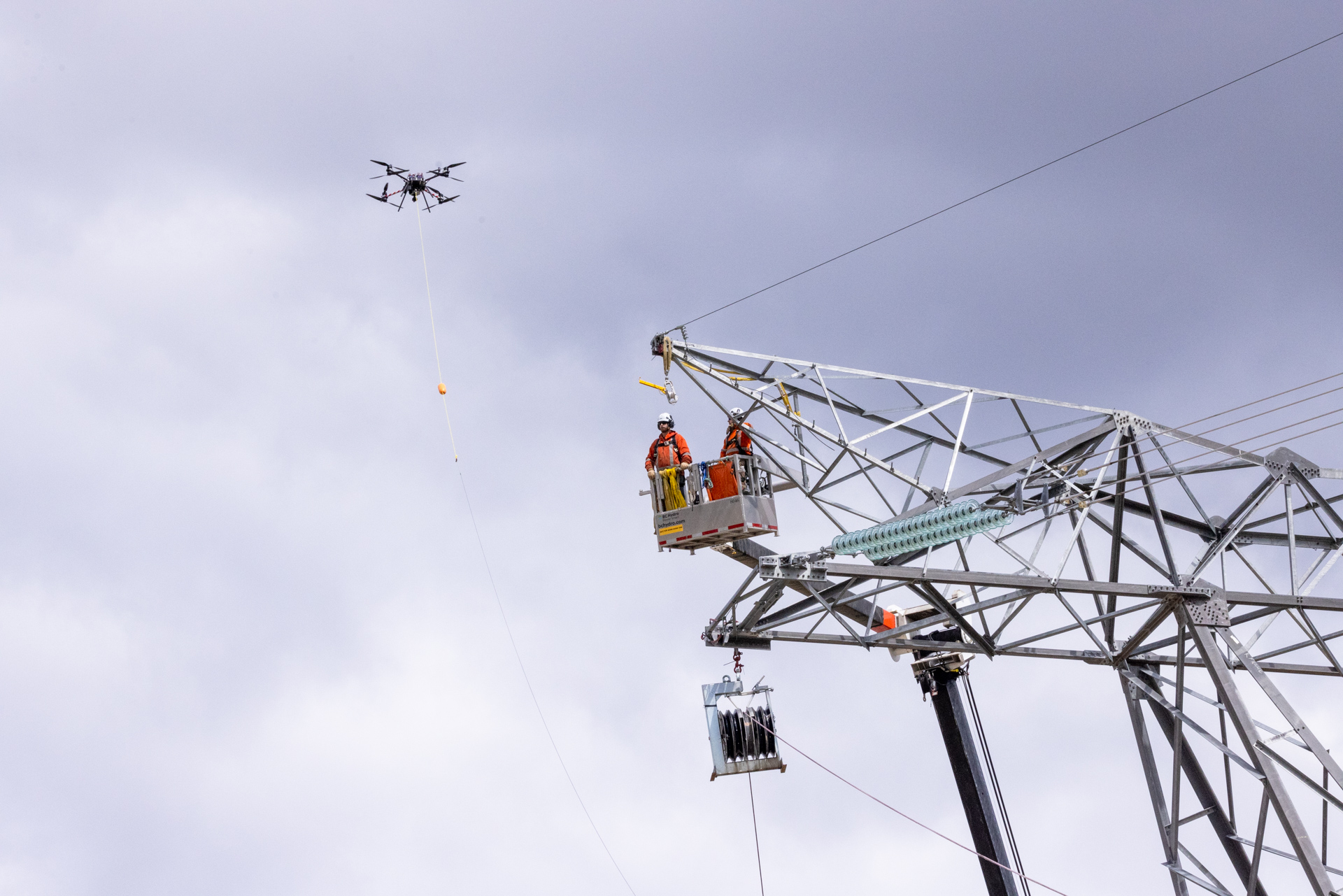 A drone is used to string the transmission lines from the substation to the powerhouse.