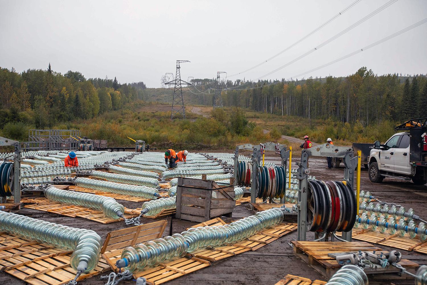 Transmission line insulator assembly takes place at a helicopter fly-yard. | September 2021