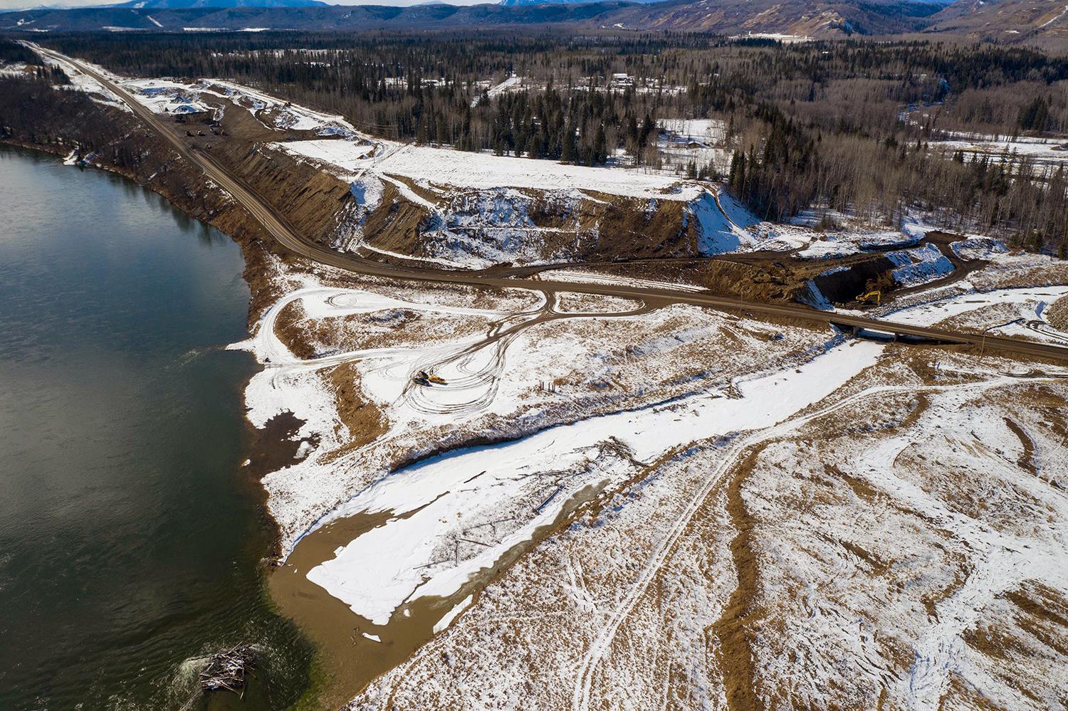 Aerial photo of the Highway 29 realignment at Lynx Creek showing work underway on the west abutment. | March 2021