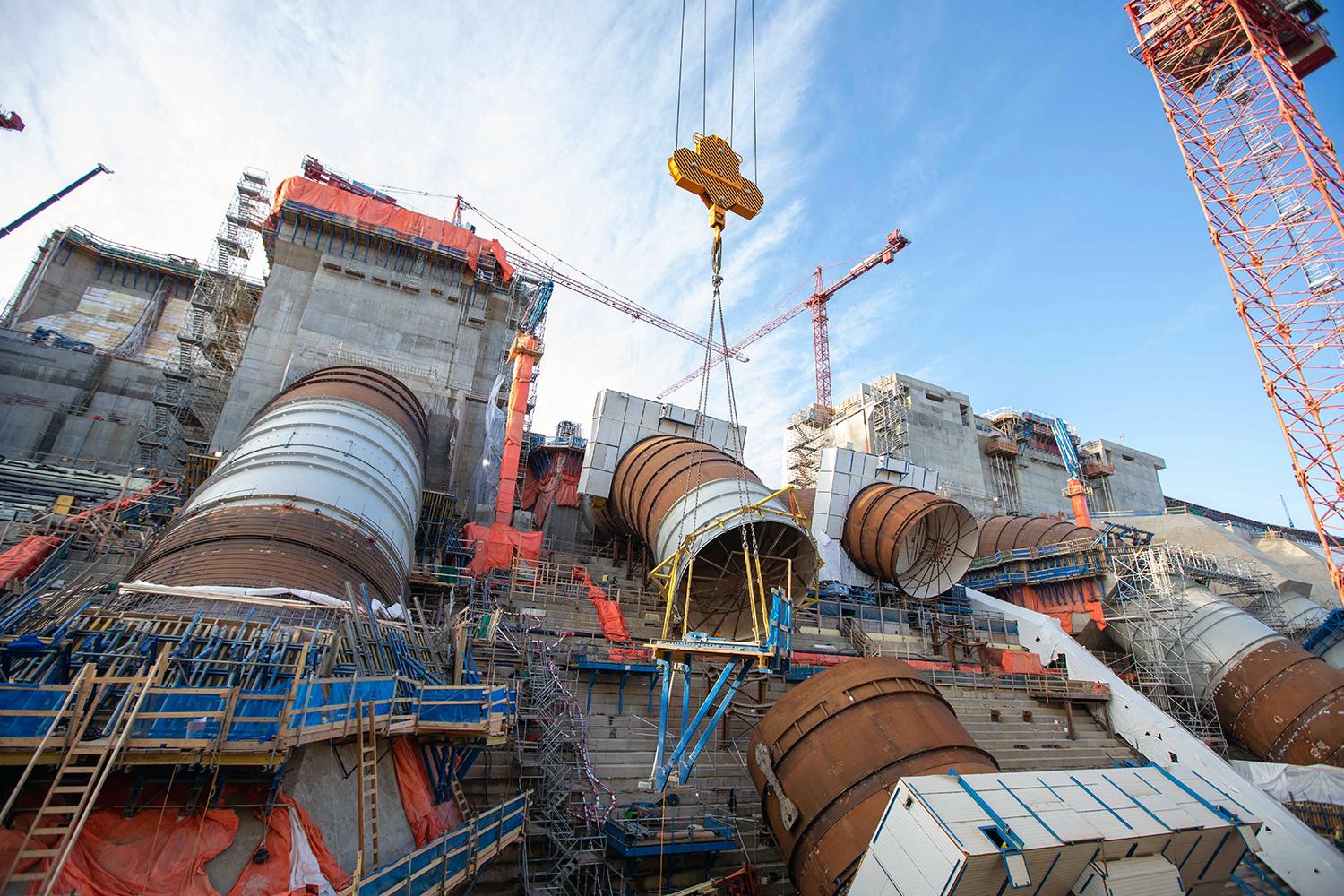 Formwork platform being lowered onto unit 5 penstock. | October 2021