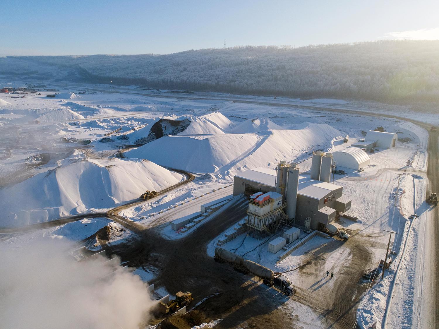 These large stockpiles of aggregate at the batch plant will be used during the winter until crushing resumes in spring. | December 2019