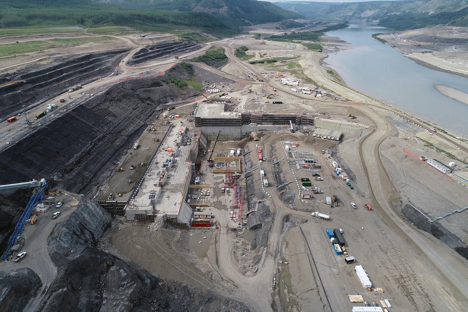 Powerhouse buttress and main service bay pad, looking upstream | August 2018