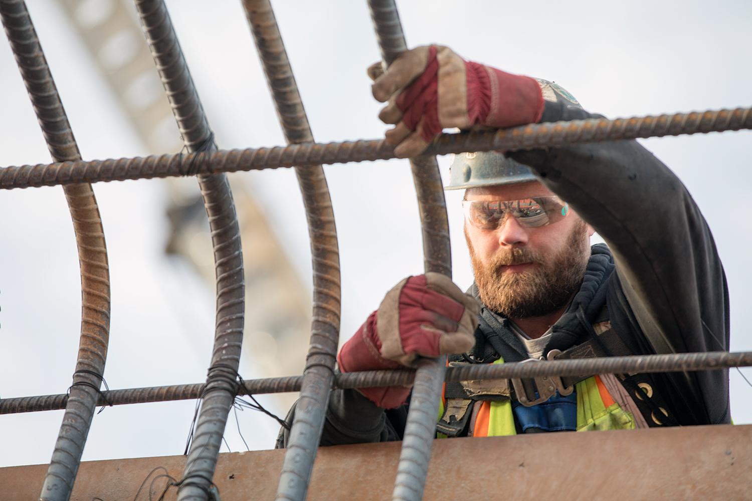 Workers installing rebar at the main service bay. | December 2018