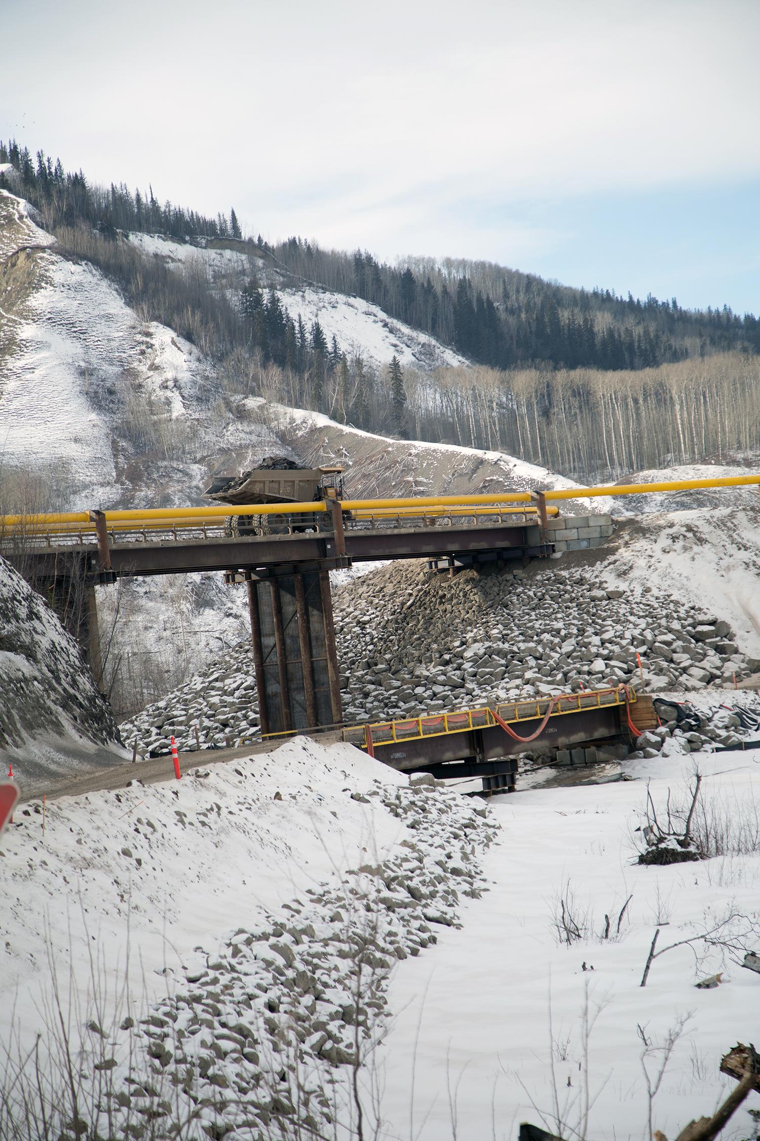 Moving waste material over the Moberly Bridge | March 2017