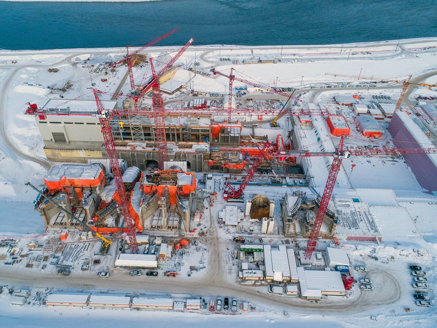 Aerial view of the powerhouse and generating station, facing north towards the left bank. | February 2020