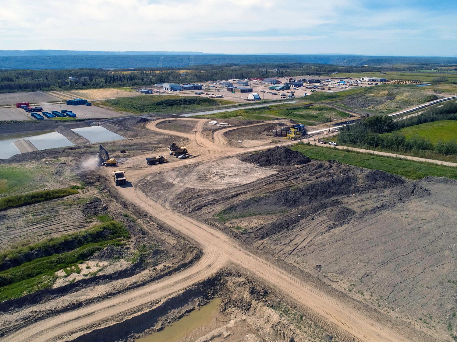 Dam core materials from the 85th Avenue Industrial Lands are transported by a conveyor system to the dam site. | August 2020