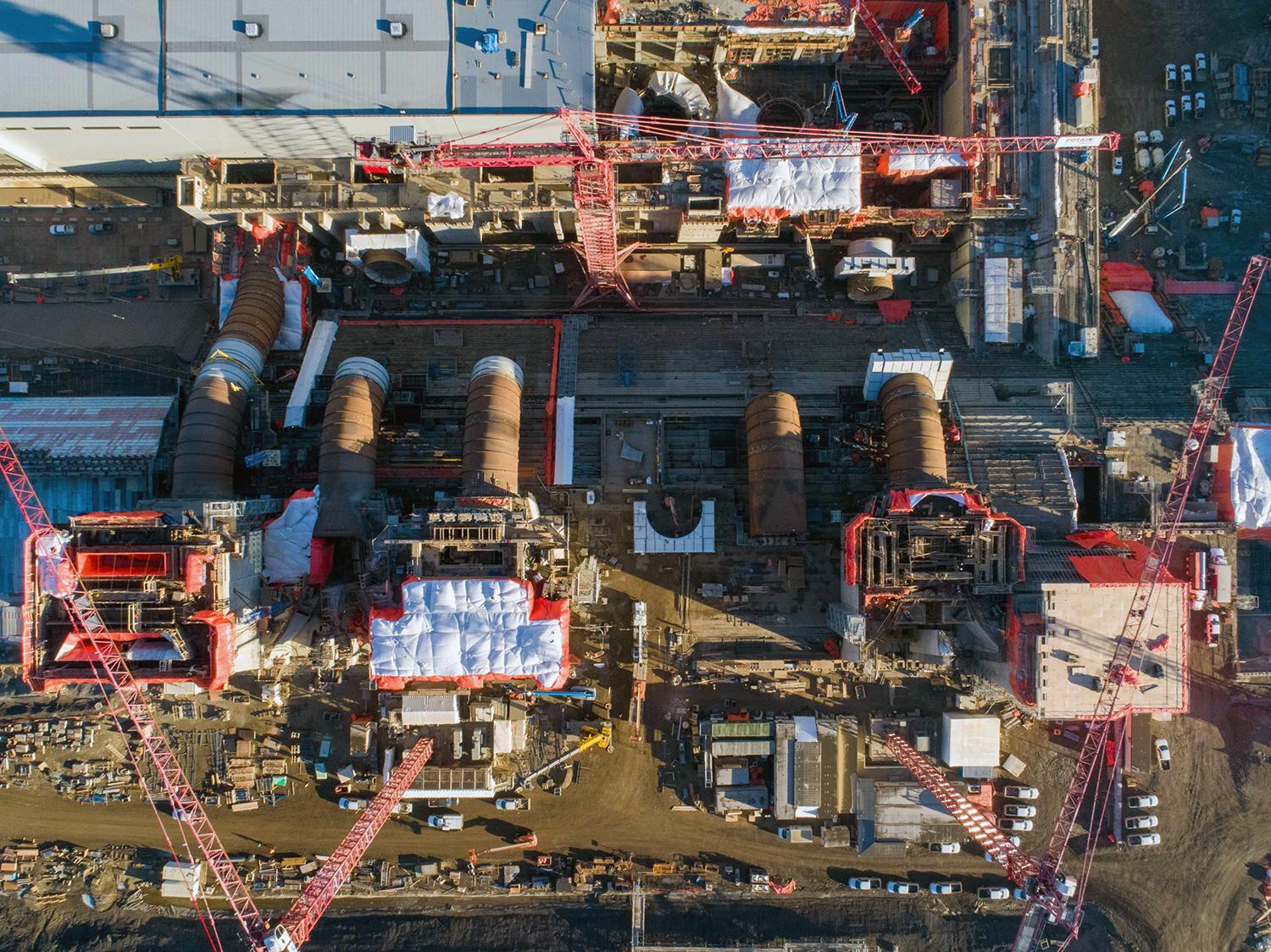 An aerial view shows the Site C intakes, penstocks and powerhouse under construction. | October 2020 