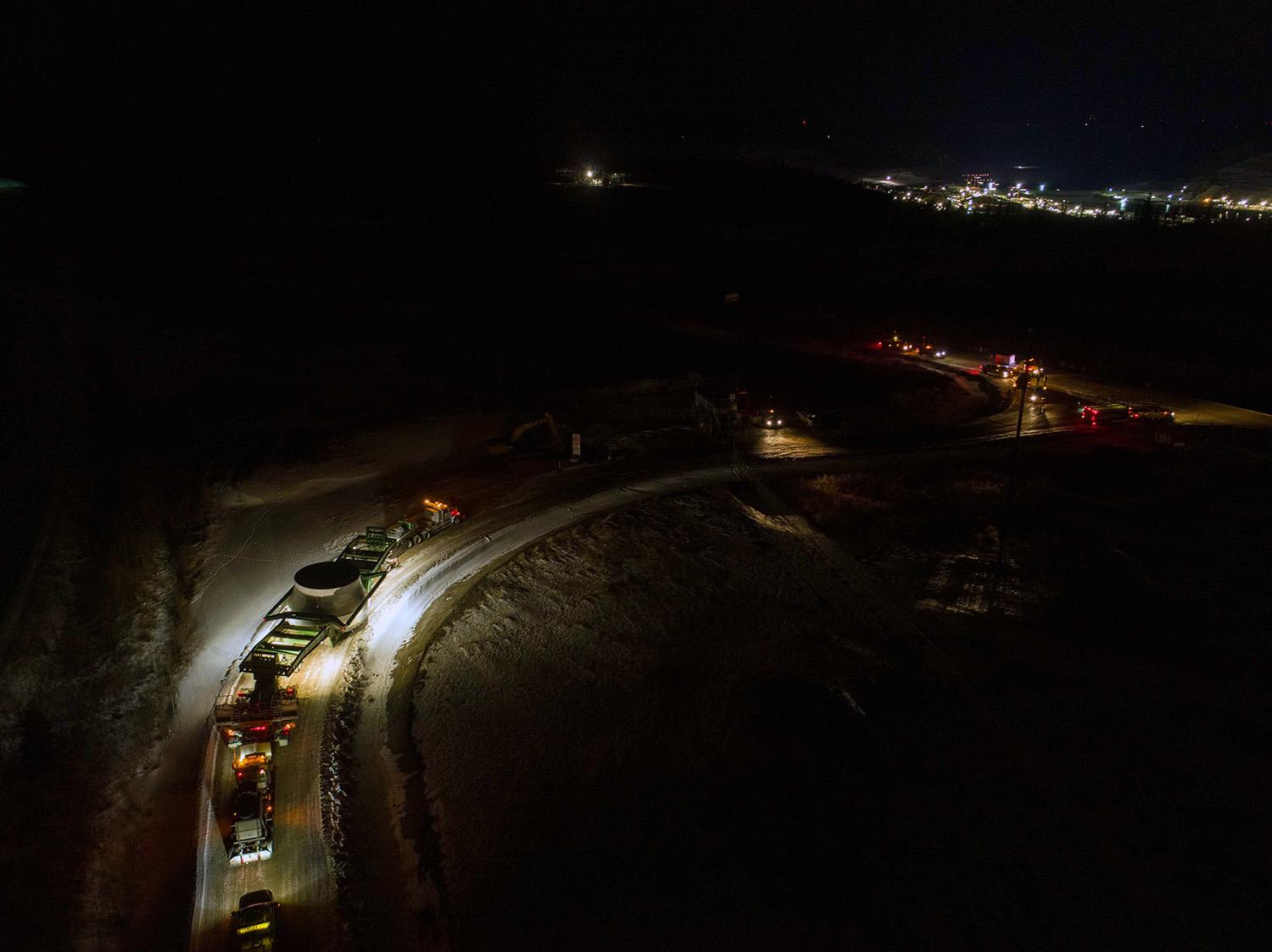 An aerial view of the Unit 1 turbine runner being transported to site. It is the heaviest unassembled single project component weighing 170 tonnes, and roughly eight metres wide and five metres tall. | January 2021