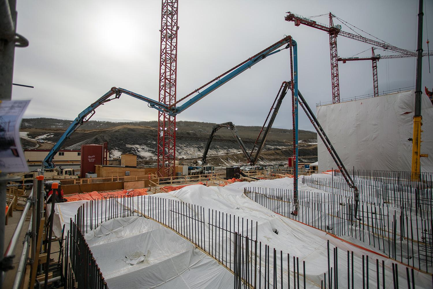 Ongoing concrete placement at the spillway headworks. | April 2021