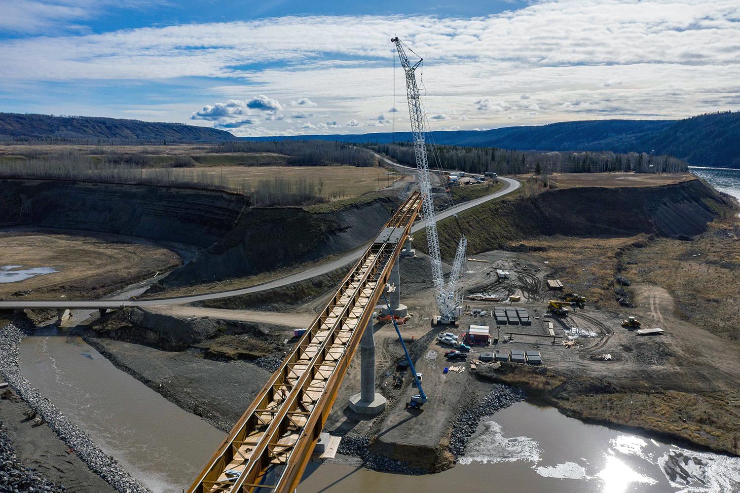 Pre-cast concrete panels have been placed between piers two and three on the Highway 29 bridge realignment at Farrell Creek. | May 2022