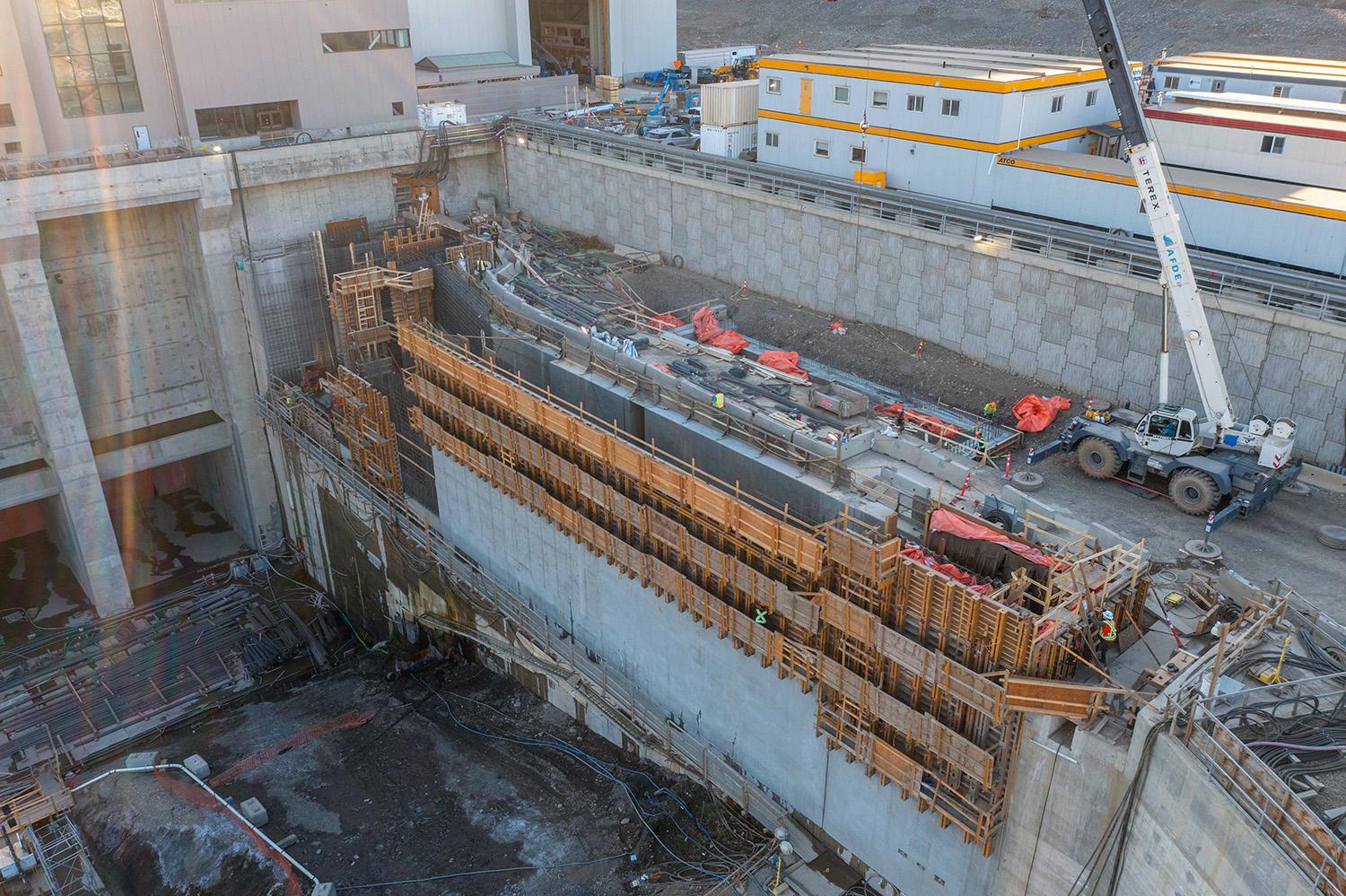 Front-view of concrete placement and formwork installation at the permanent upstream fish passage facility. | October 2022