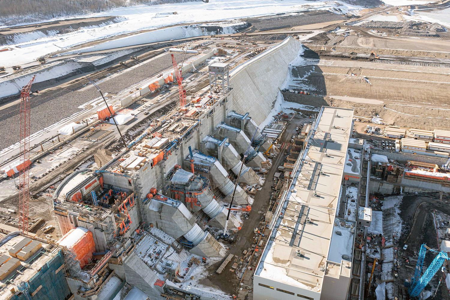 Water will flow down the approach channel (left) and down through the six penstocks (centre) into the generating station. | March 2023