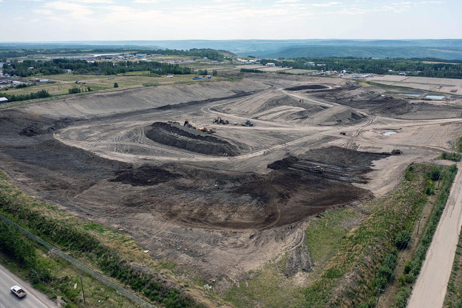 The 85th Avenue Industrial Lands, where the glacial till used to build the dam is extracted and transported by conveyor to site. | June 2023