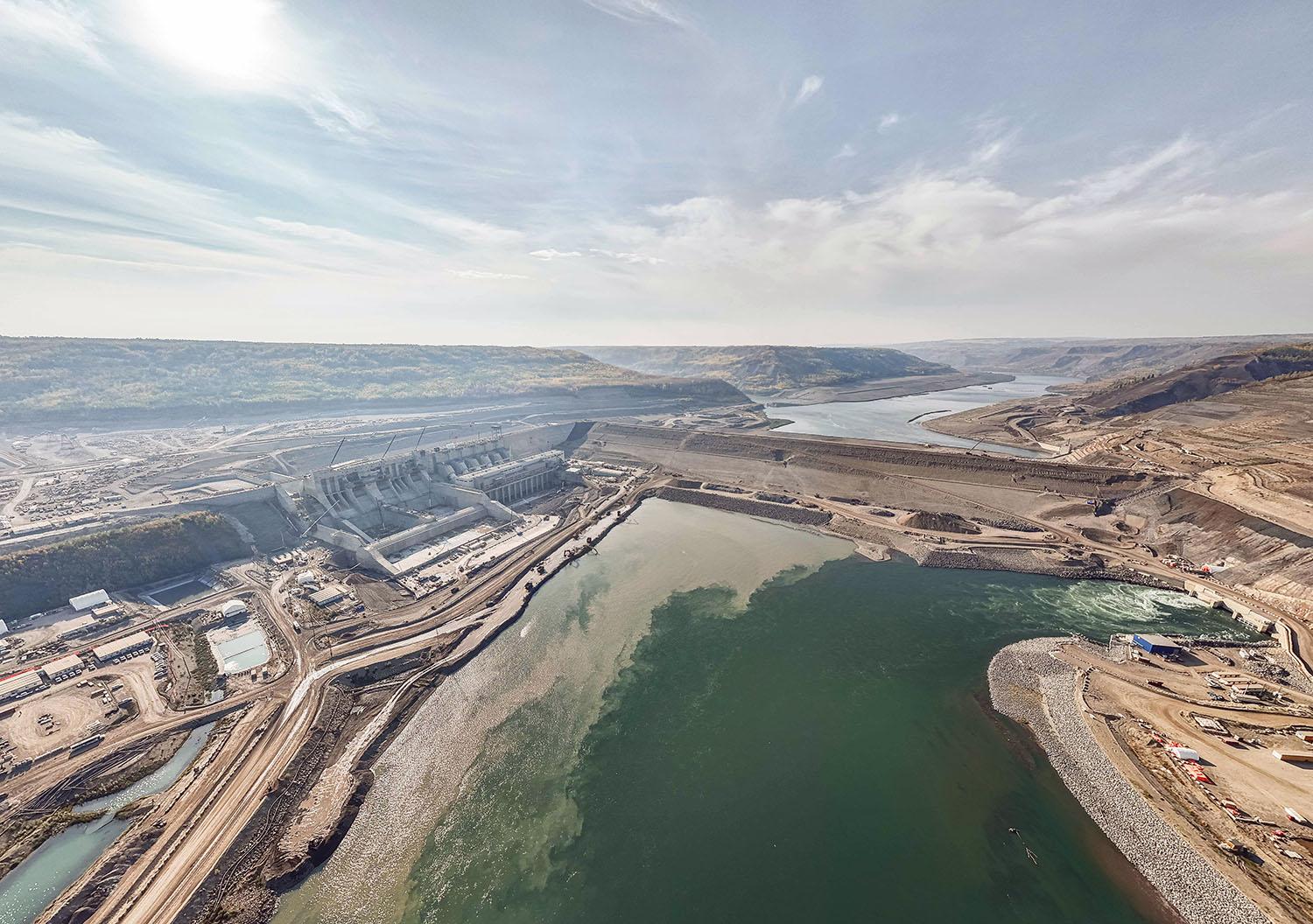 The Site C dam is at its full height, which is the equivalent of a 22-storey building. When the reservoir is filled, the dam will direct water to the approach channel.