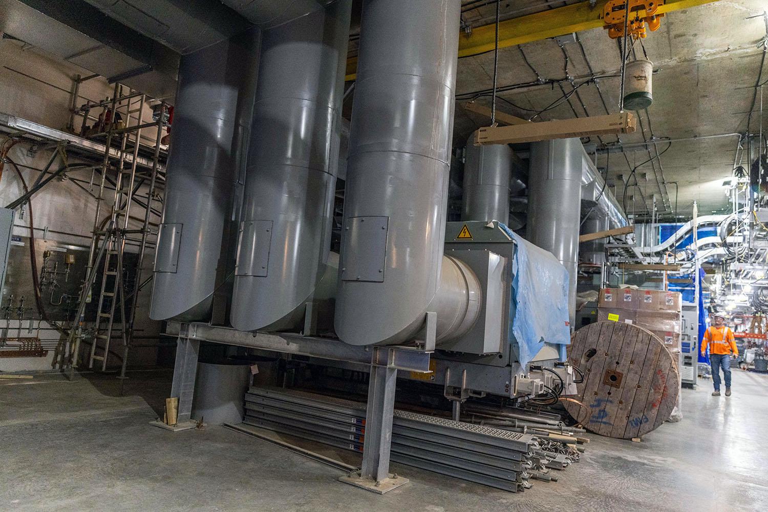 Electricity passes from the generator through the isophase bus to the step-up transformer and into the transmission towers.