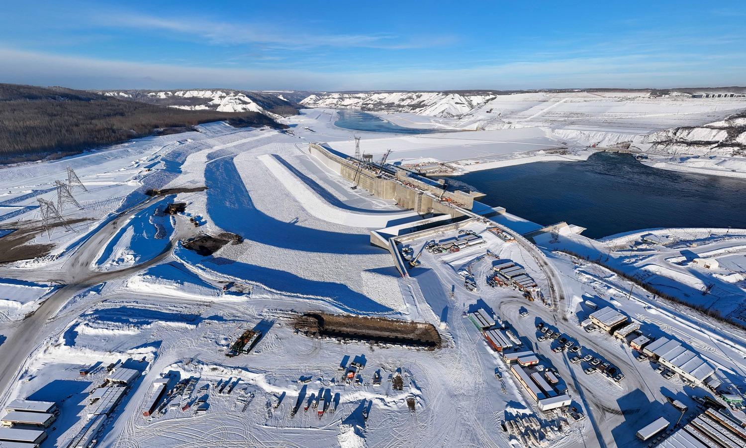 The approach channel nearing completion covered in a blanket of snow.