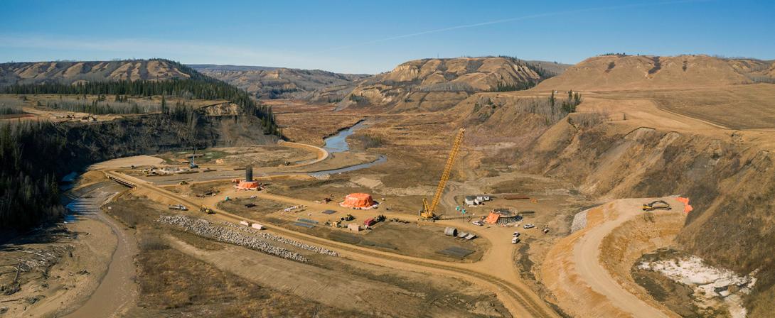 The Site C reservoir will cover the existing highway, requiring the highway realignment and a new bridge across Cache Creek. Here, the bridge is shown under construction. | April 2021