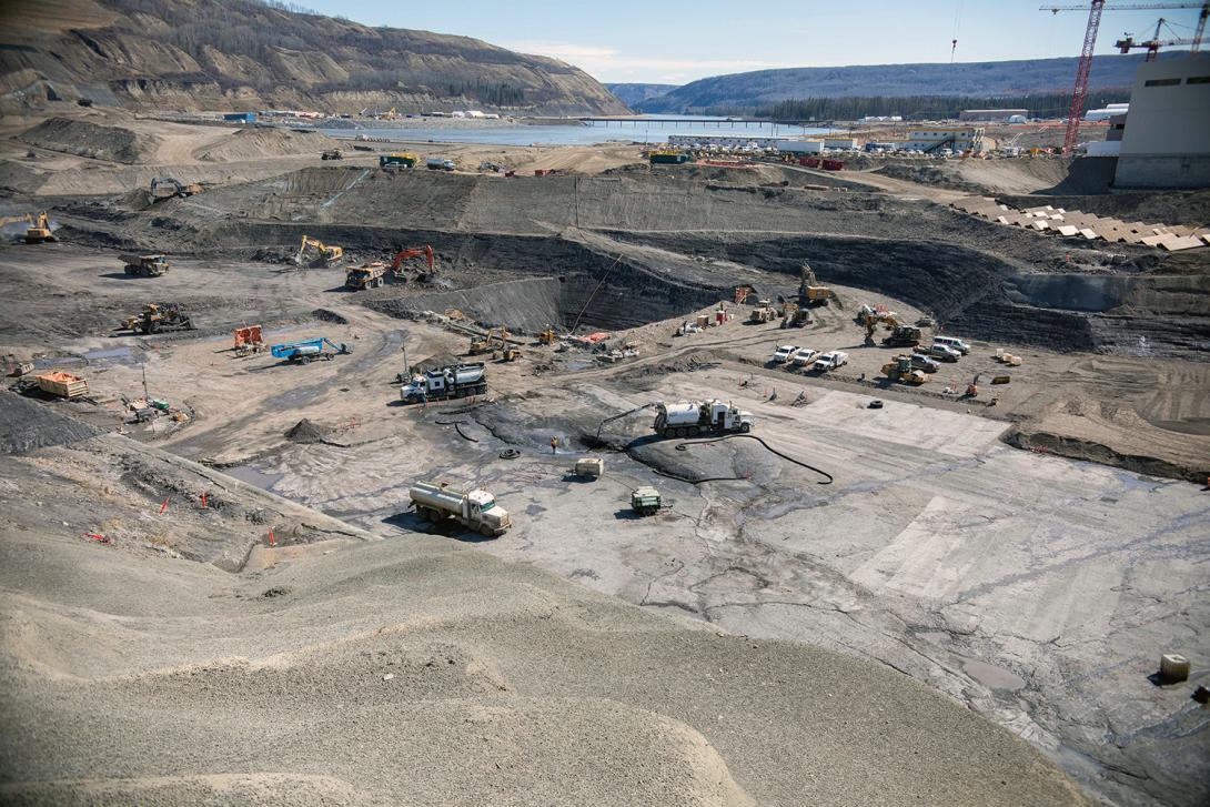Crews clean the bedrock and excavate the dam core area where the earthfill dam will be constructed. | April 2021