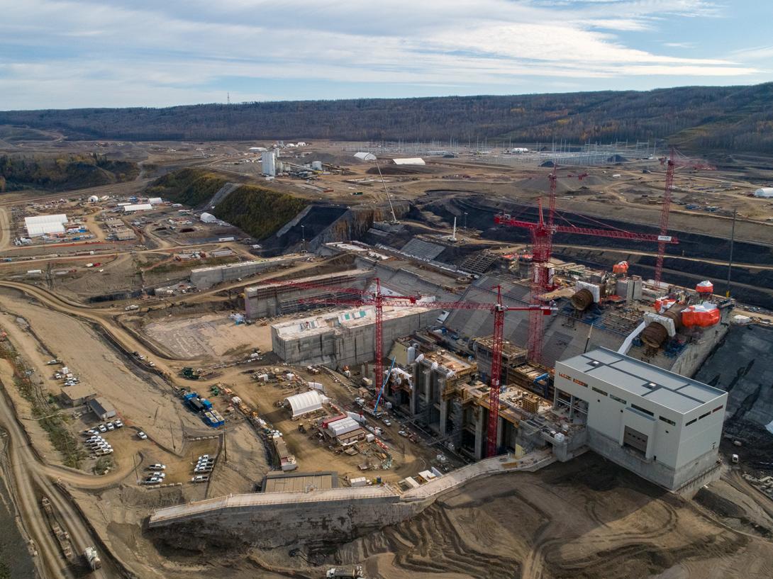 An aerial view of the right bank shows the powerhouse, intakes and spillways. | September 2019