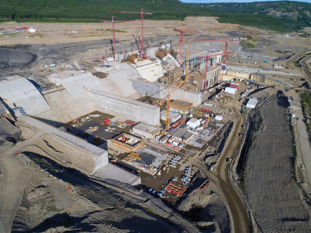View of the spillway headworks, stilling basin, intakes, penstocks and powerhouse. | July 2020