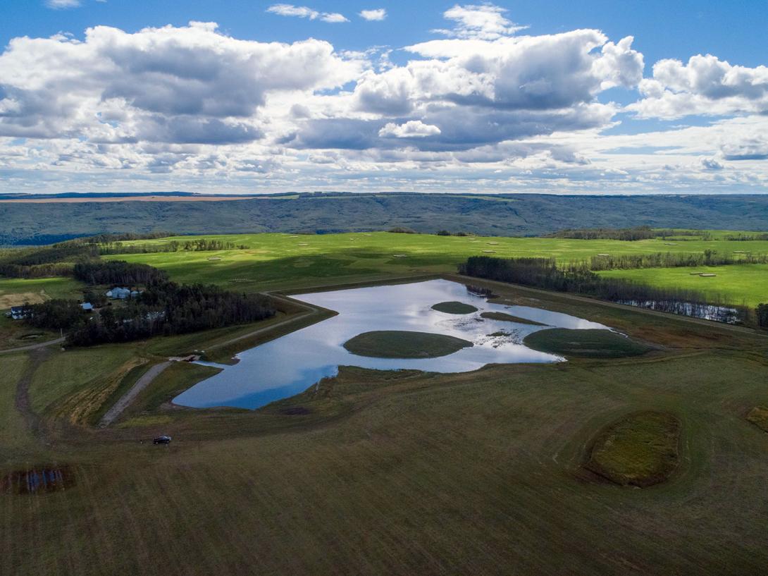 The main basin of the Golata Creek wetland – completed in October 2019 – fills with water. | August 2020