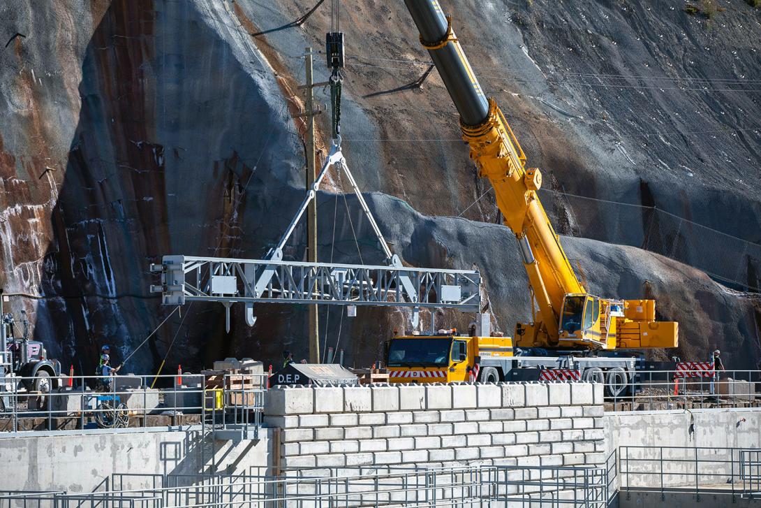 Positioning stoplog lifting beam into position to remove a stoplog segment from the diversion tunnel 2 outlet following leakage testing. | September 2020