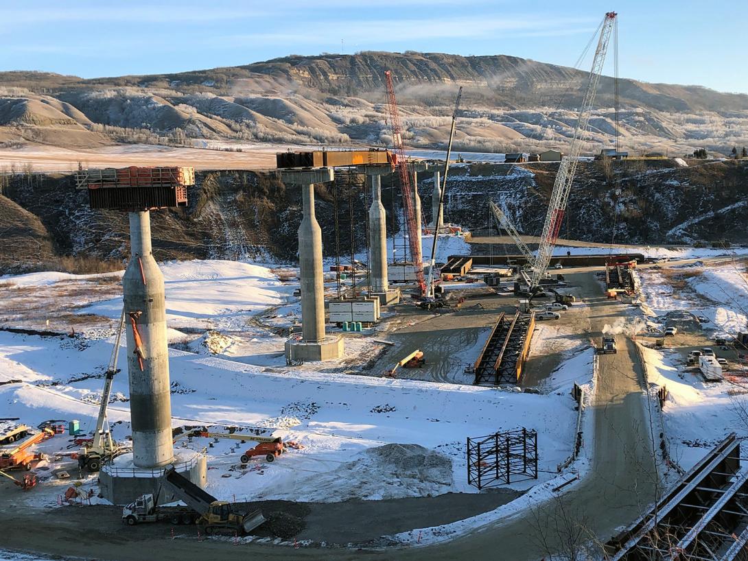 Crews prepare to lift a triple-girder section at the Cache Creek bridge realignment on Highway 29. | December 2021