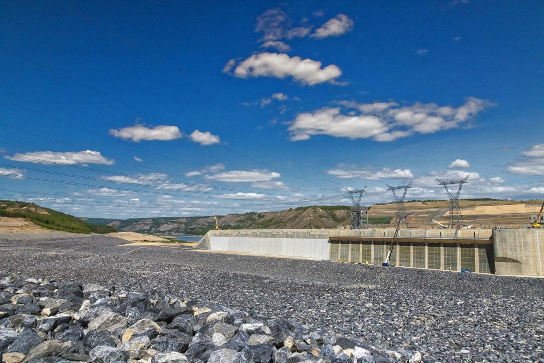 Water will flow down the approach channel and through the intakes. Transmission lines cross over the approach channel to connect the Site C substation to the generating station. | May 2024