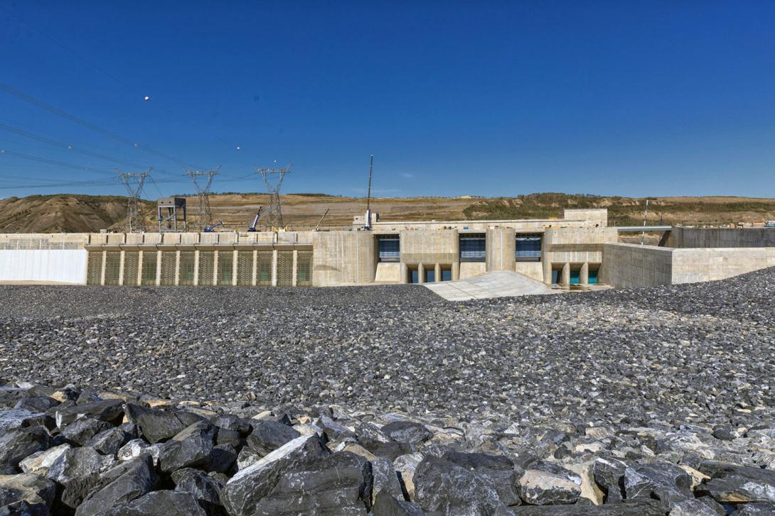 Reservoir filling began on August 25. Water will start flowing into the approach channel and pass through the lower-level outlet gates (pictured at centre right), to maintain downstream flows when the diversion tunnels are closed. | August 2024