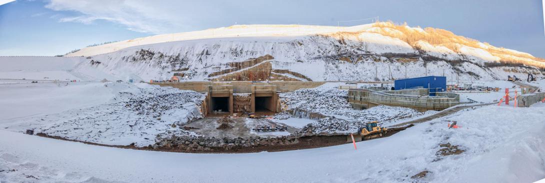 The diversion outlet tunnels are opened, and drained. These tunnels will be backfilled with gravel and permanently closed with a concrete plug. | December 2024