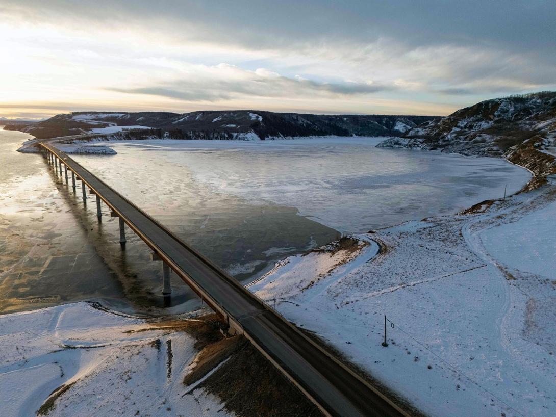 Ice forms at the confluence of the Halfway River where Highway 29 crosses the Peace River. | January 2025