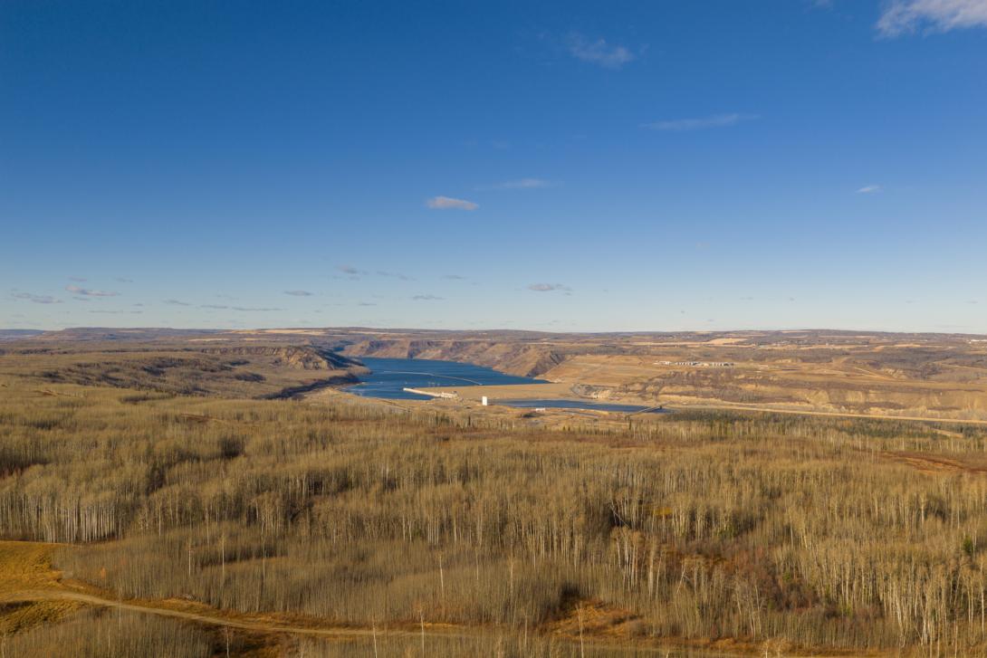Aerial view of the Site C dam and generating station from the Septimus Railway siding on the south side of the construction site. | October 2025